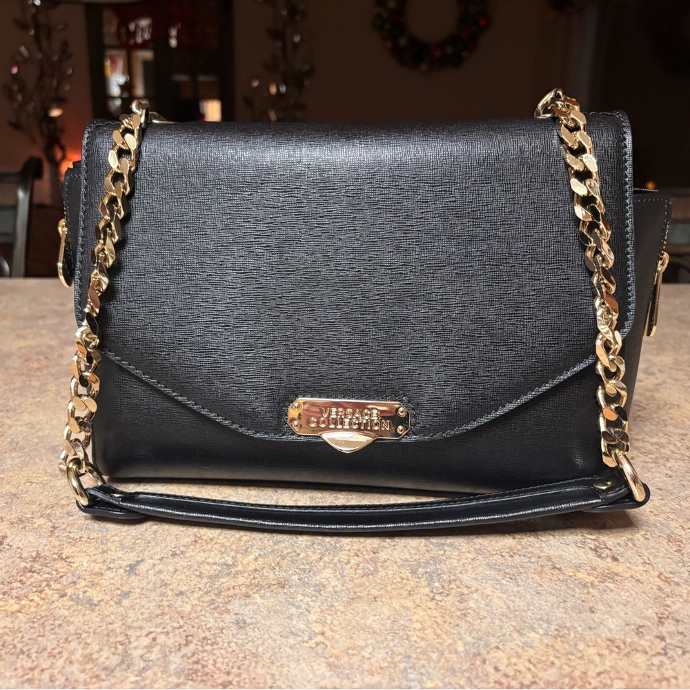Brand-new black Versace purse